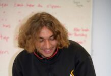 Students learning barbering skills