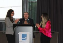 Students receive graduation certificates