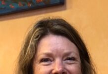 Women getting amongst the vines