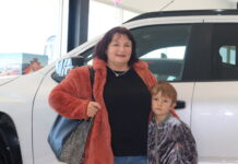 Shiny cars and wide smiles