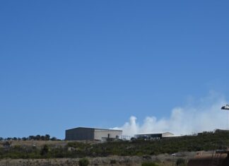 Shed in flames at dump